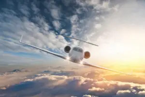 Private Jet Flying Above the clouds